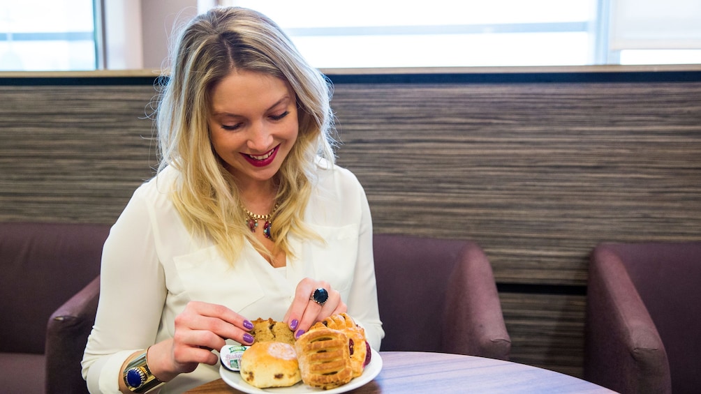 woman enjoying pastries at the airport lounge