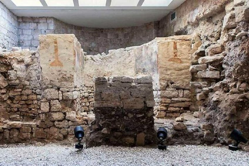 Palazzo Simi - Remains of the Byzantine church found in the basement, with a view of the block altar and the apses