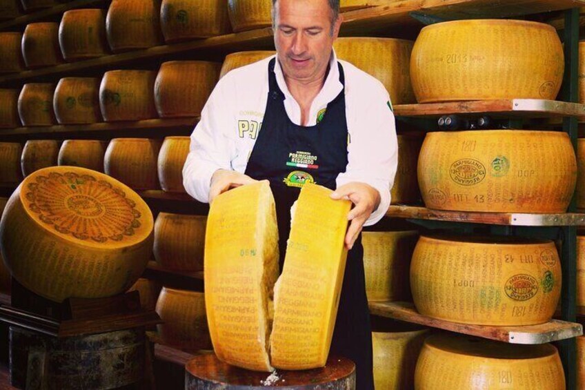 Parmigiano Reggiano Cheese Warehouse and the opening of the wheel...you'll be amazed by the delicious scents! | Artemilia Guided Tours | Slow Parma Food Experience