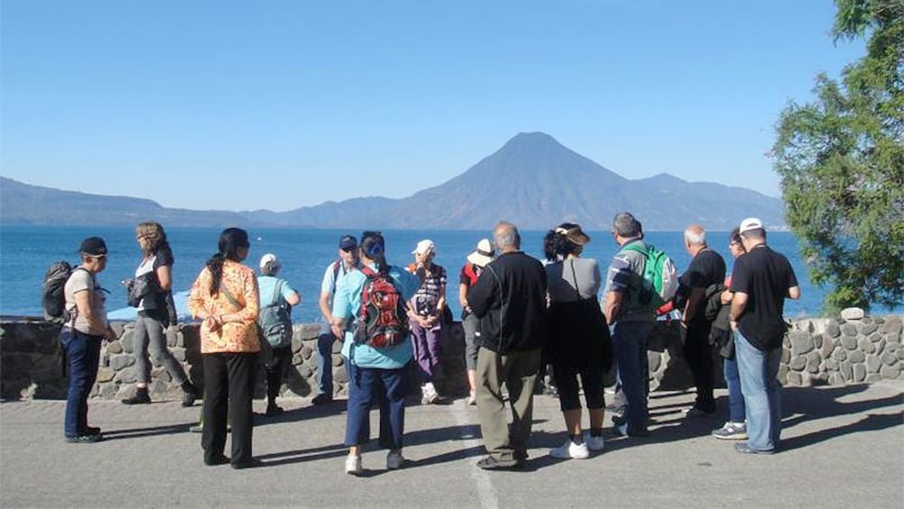 Tour group viewing Lake Atiltlan of Guatemala which is the deepest lake in Central America 