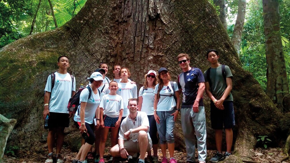 Group pose for photo at the ancient Mayan city of Tikal