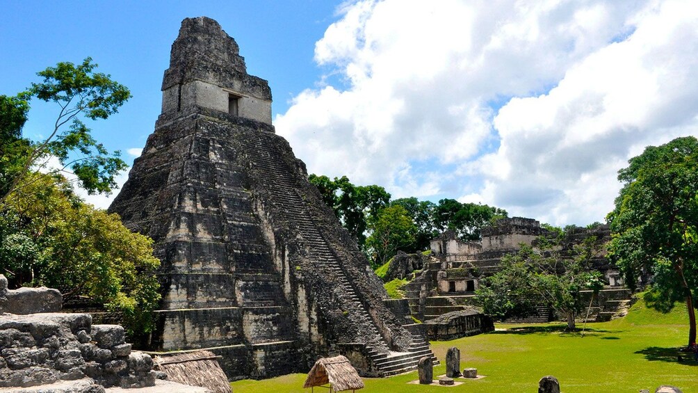 Temple towers over other ruins in ancient Mayan city of Tikal