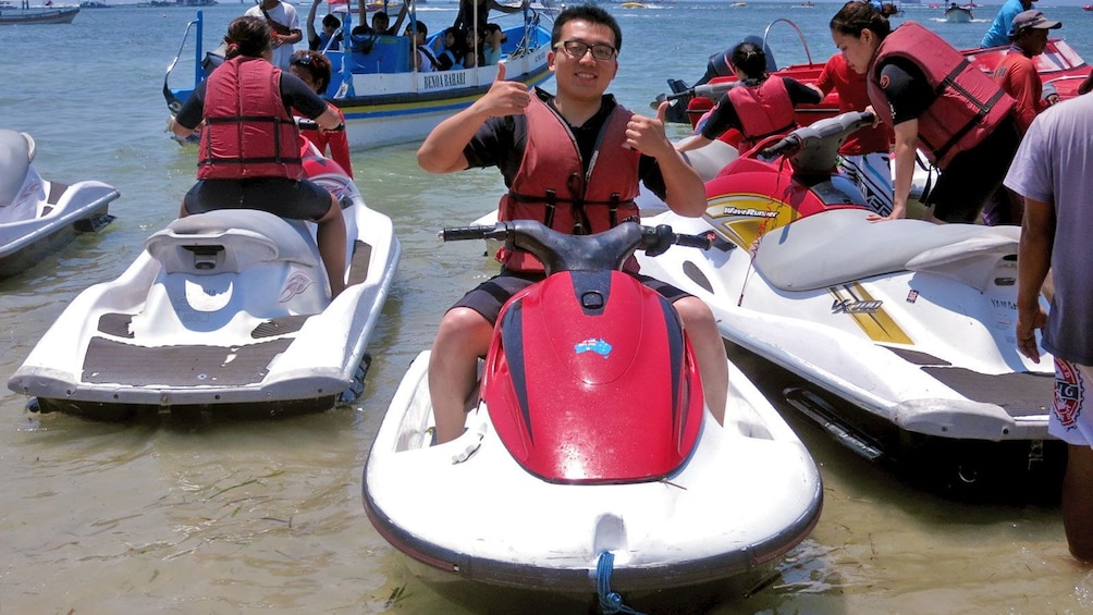 Show item 1 of 5. man on jetski at the beach in Bali