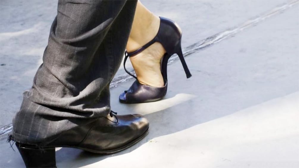 Close up of a couples' feet as they tango dance at the Tango Porteno Show in Buenos Aires