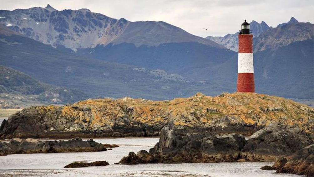 Serene view of a lighthouse and mountains in Ushuaia