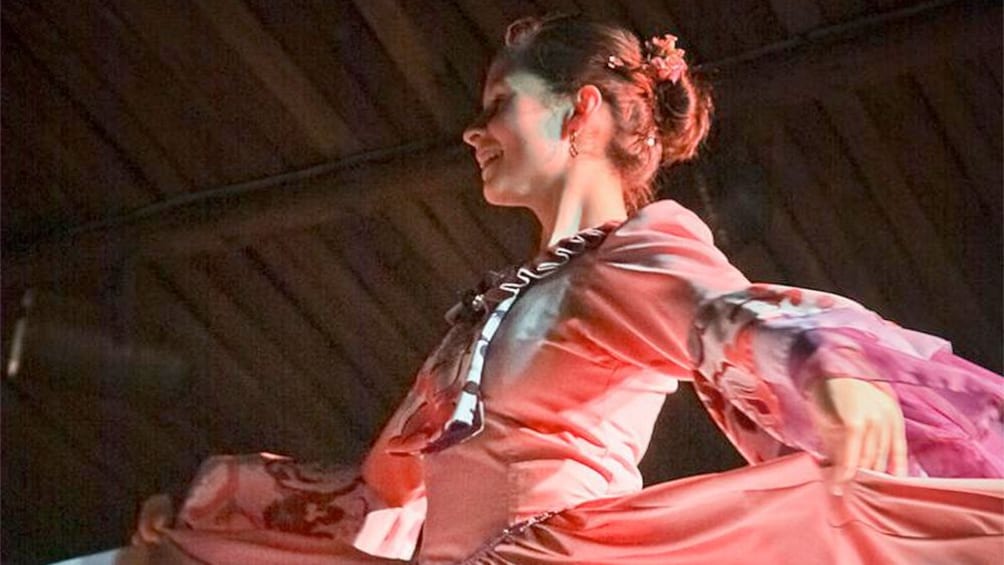 Woman dancing a traditional dance at gaucho night in Porto Alegre