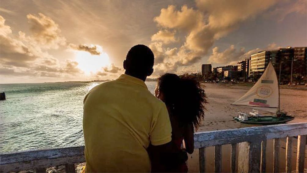 Couple enjoys sunset view of the beach in Maceio 