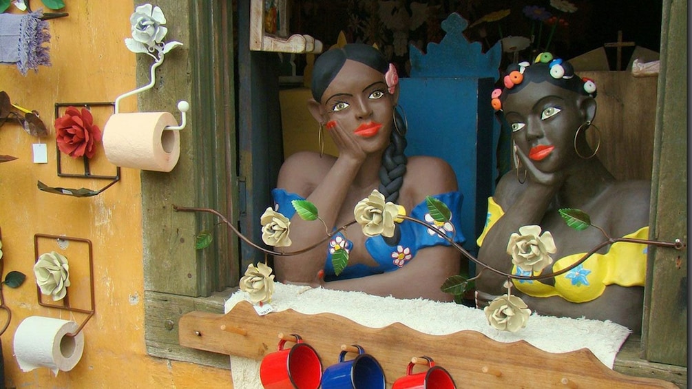 Show item 2 of 10. Painted life-size statues in the window of a craft shop in Sao Paulo
