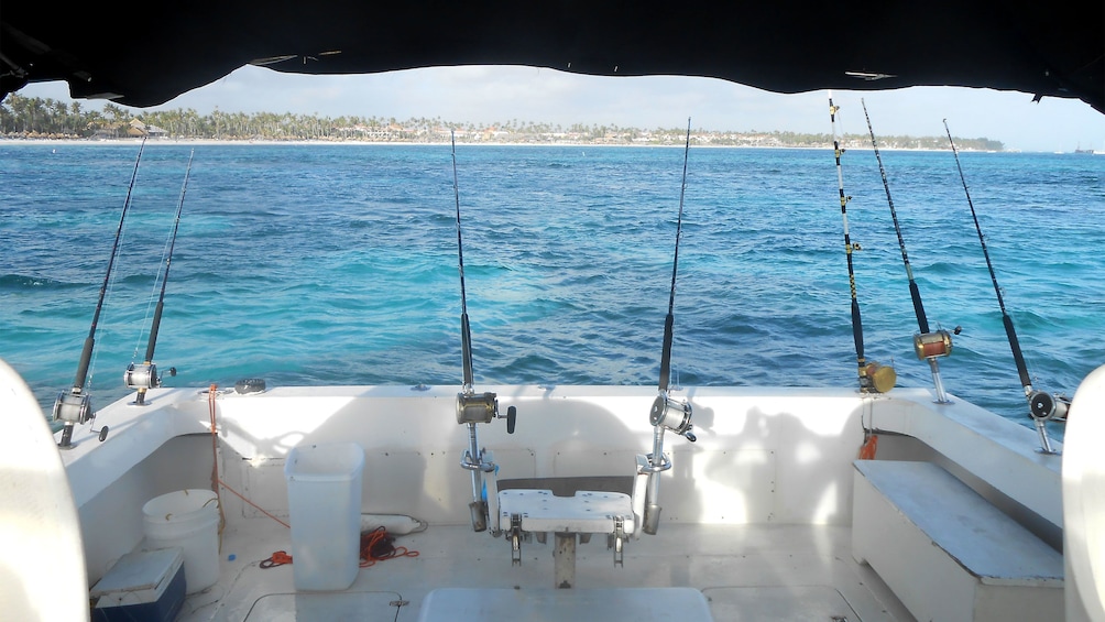 Deep sea fishing poles mounted to the back of a fishing boat in Punta Cana
