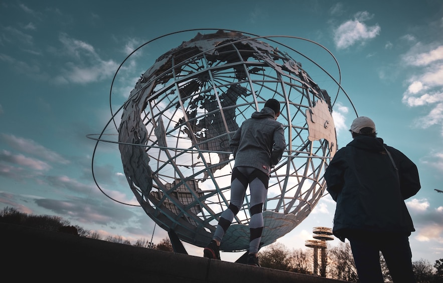 Sightseers looking at World's Fair Globe in Queens