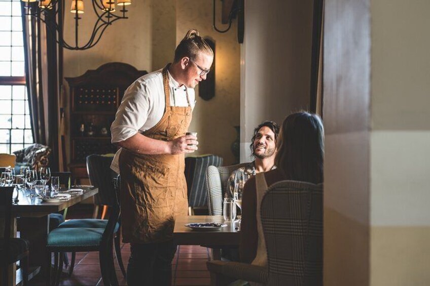 Chefs serve some of the menu courses