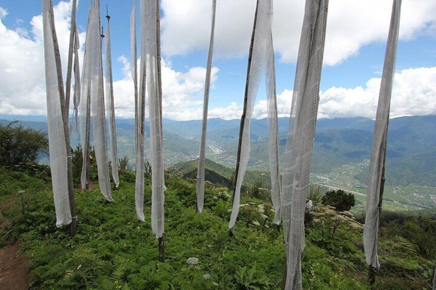 Prayers flags hoisted on serene hilltop