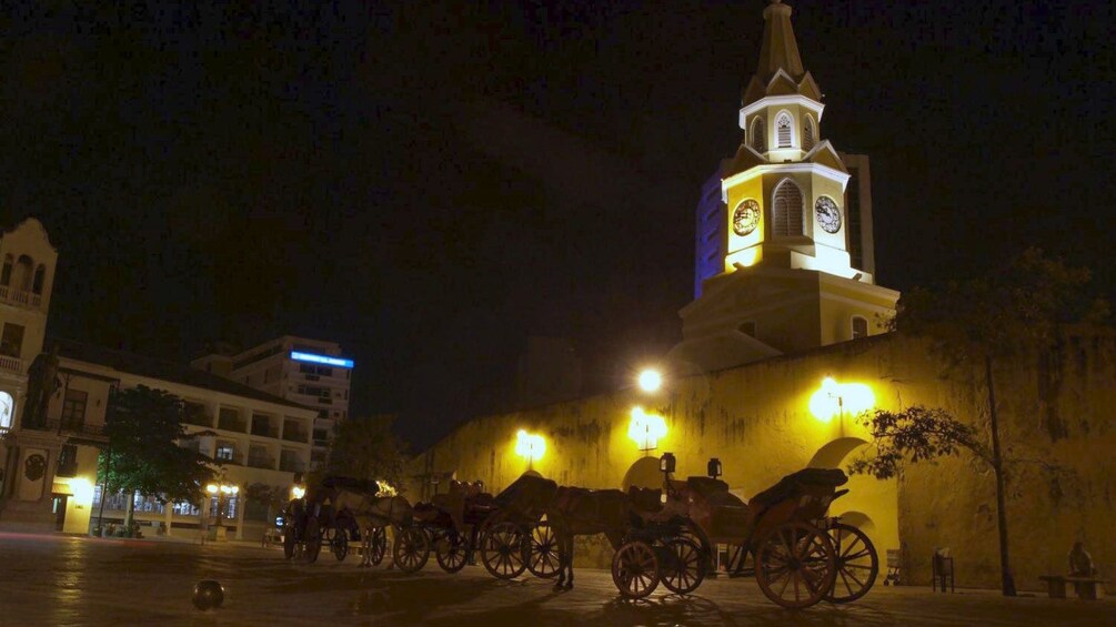 Horse carriages line the streets of Cartagena inviting tourists to ride along and tour the city at night