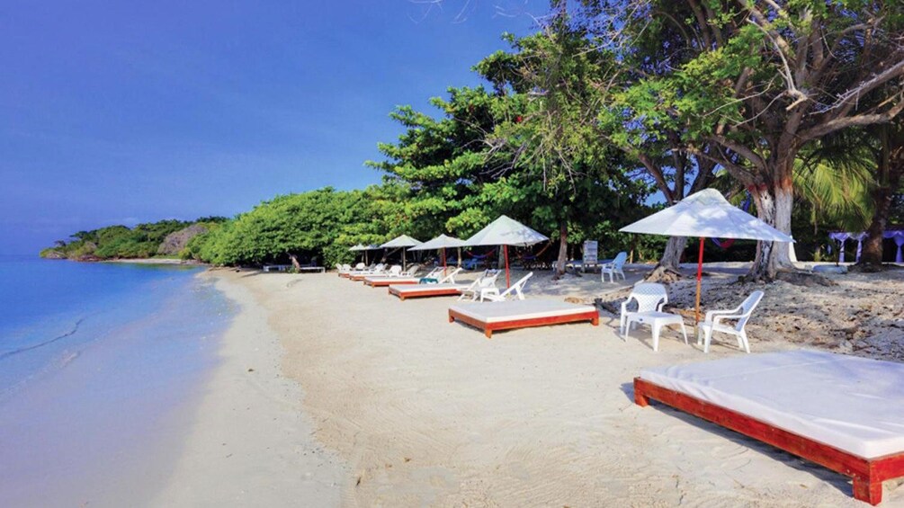 Beach front cabana's line the shores of the Rosario Islands