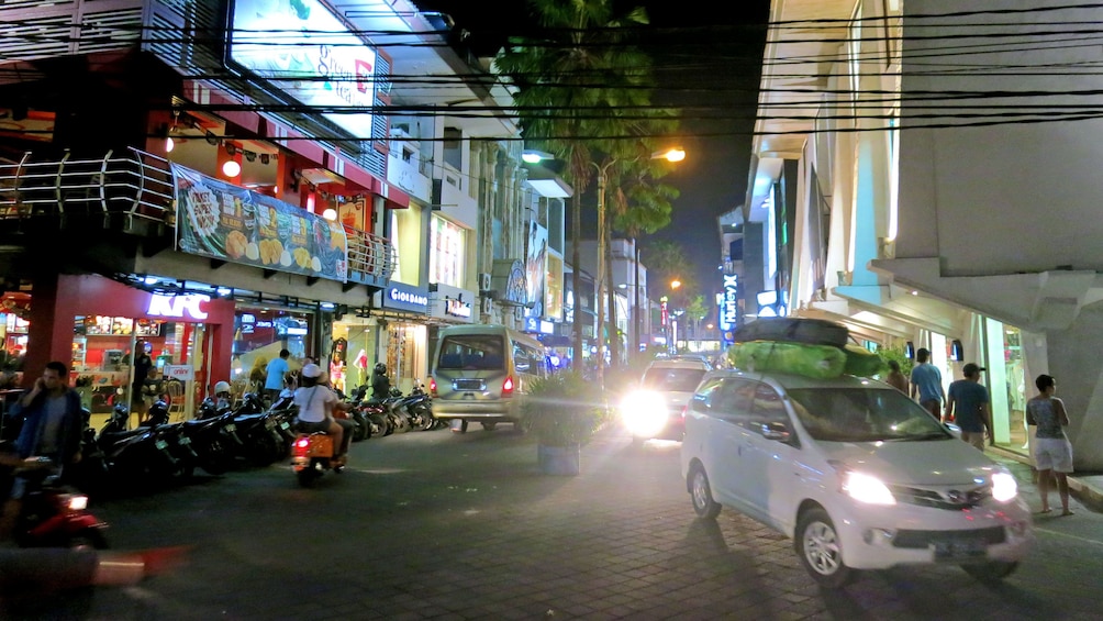 shopping and dining establishments on the streets at night in Bali