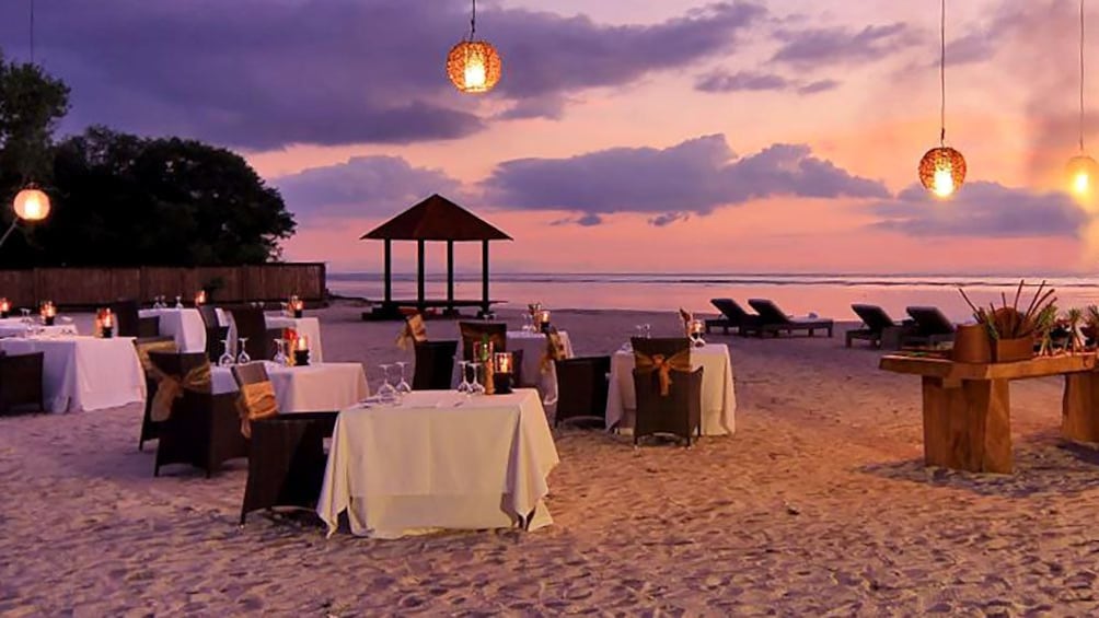 romantic dining setup at the beach in Bali