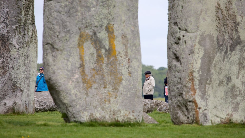 Looking through the rocks at visitors to Stonehenge in England