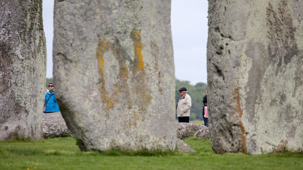 Looking through the rocks at visitors to Stonehenge in England