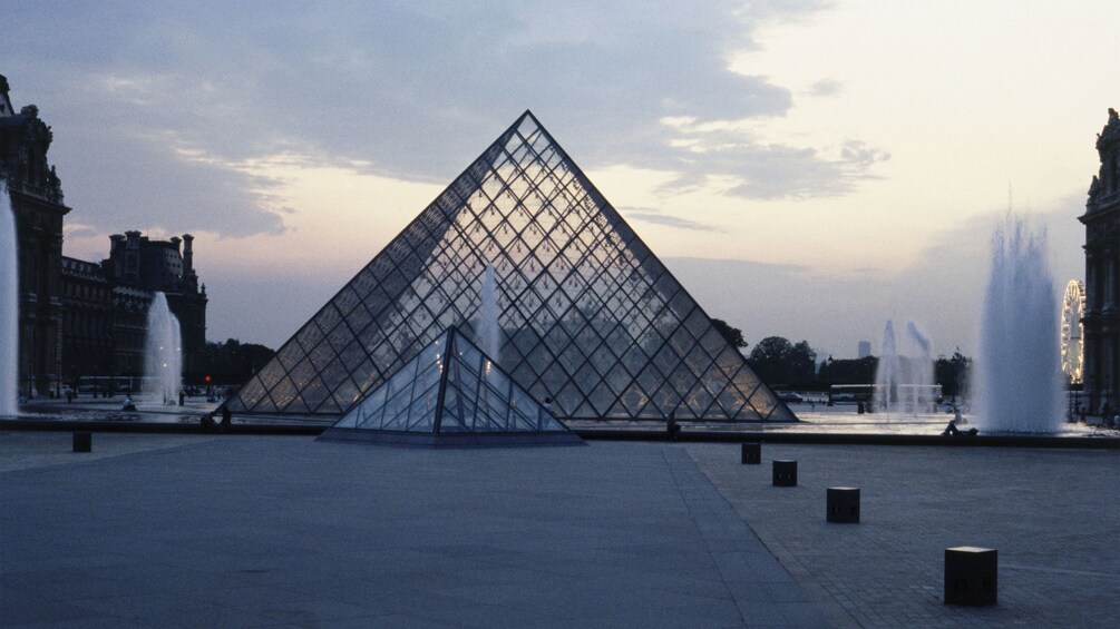 Glass pyramid and fountains outside the Louvre Museum in Paris