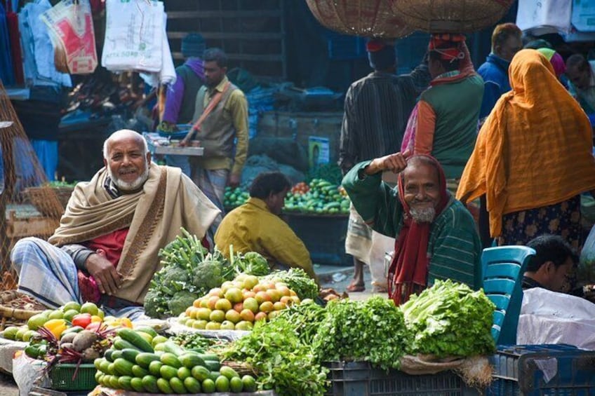 Friendly elderly vegetable sellers.