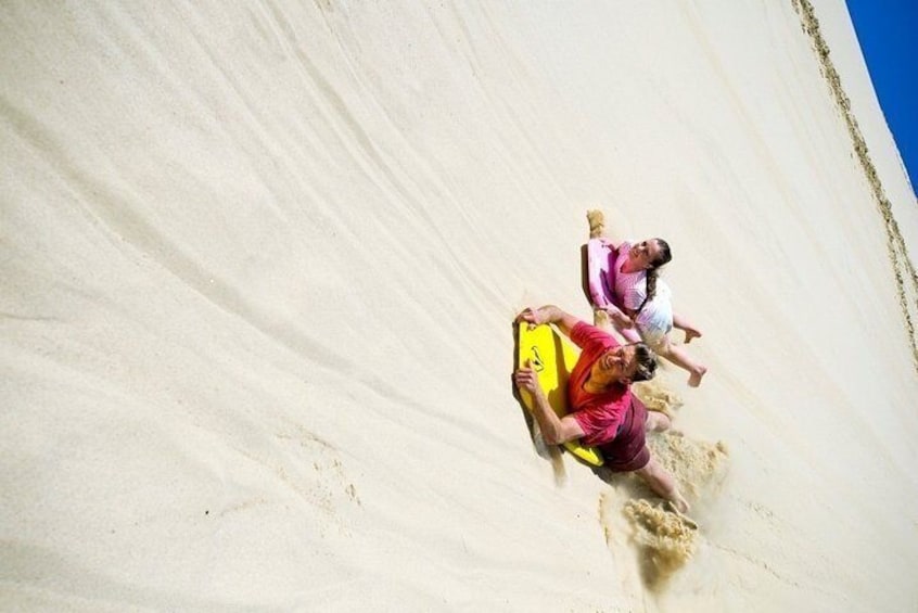 Sand boarding at Te Paki dunes