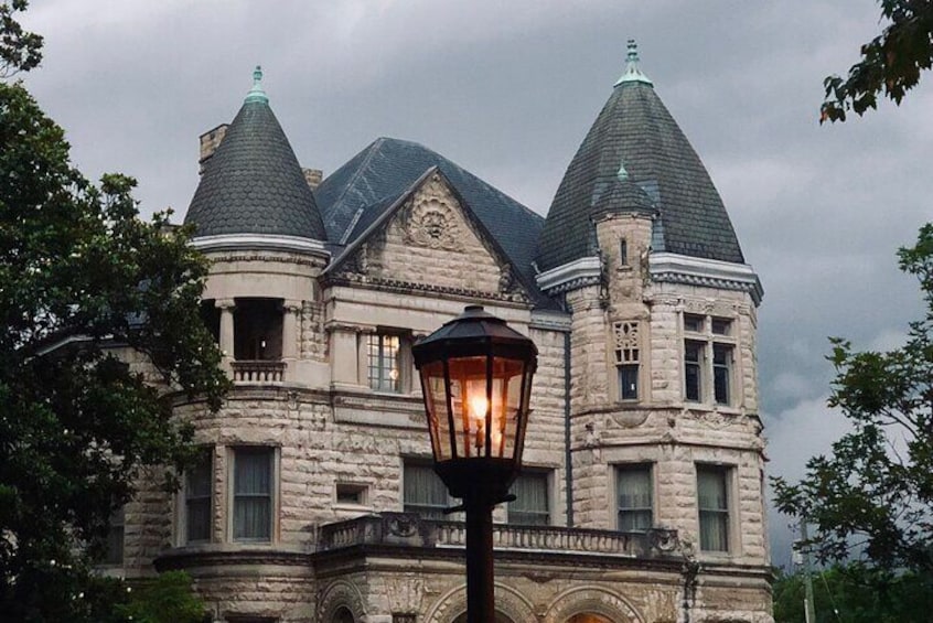 24-hour gas light illuminates the lovely Conrad's Castle on St. James Court.