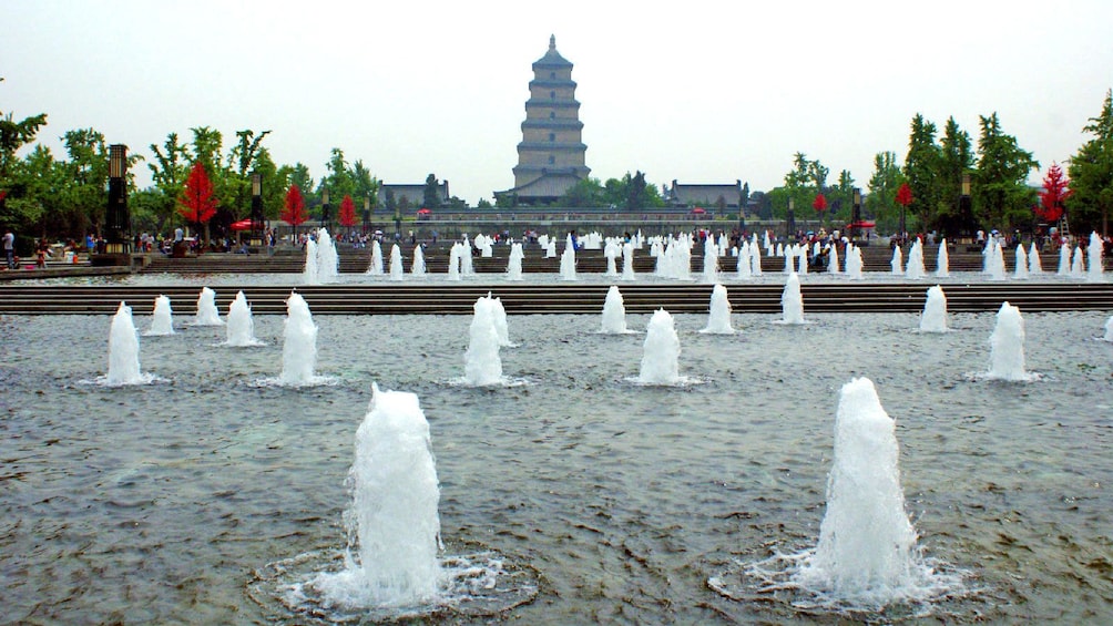 water fountains in front of a tall pagoda in Xi'an