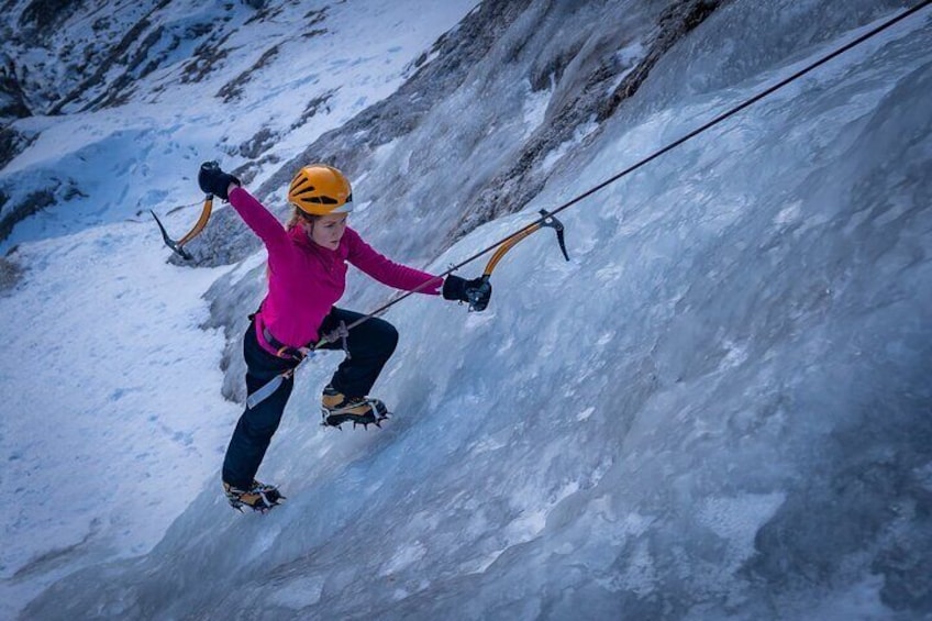 girl climbing on the frozen mountain field