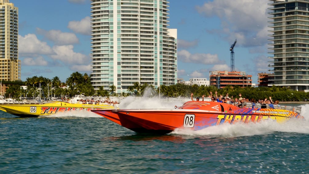 Two Thriller speedboats race through the waters off Miami