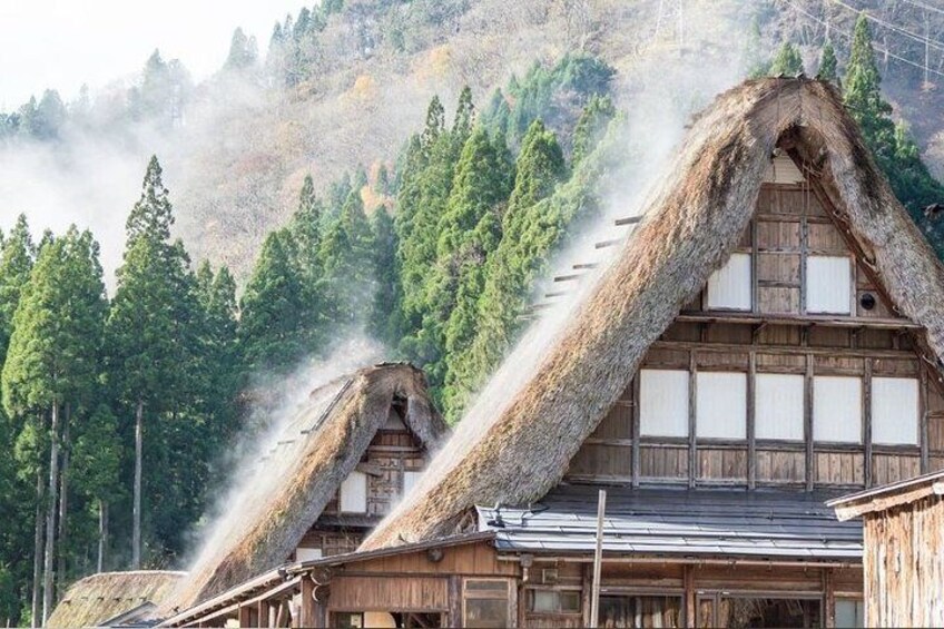 Steam rises from the Thatched roofs of Shirakawago