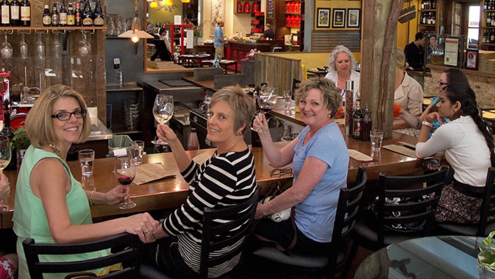 Ladies drinking wine at a bar in California