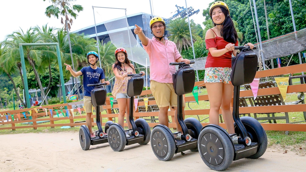 Show item 2 of 5. Family enjoying the Sentosa Segway Tour in Singapore