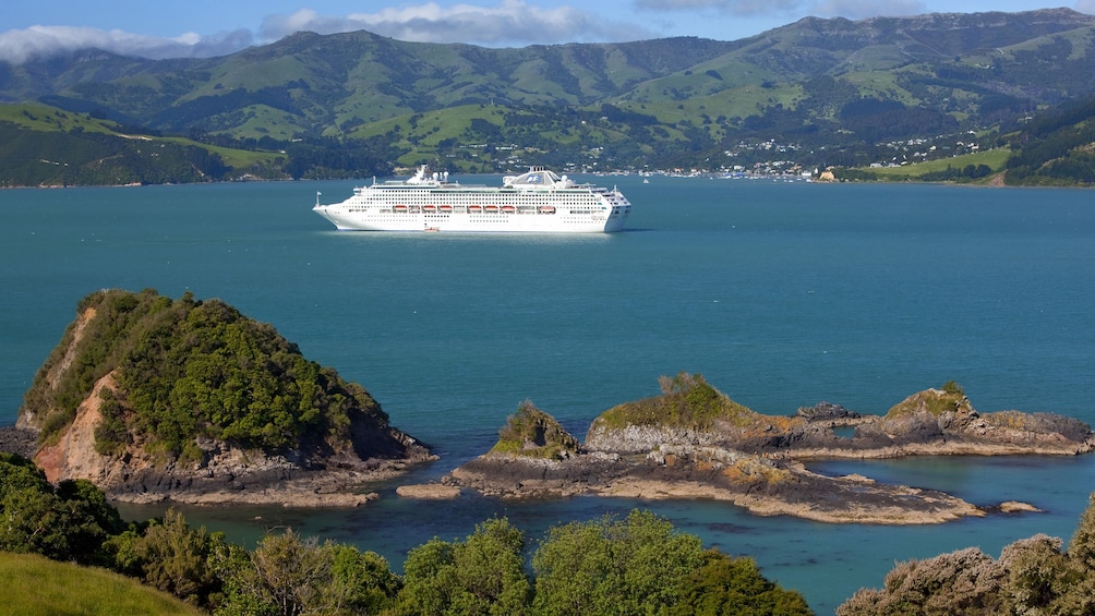 Cruise ship sails through Banks Peninsula on the east coast of the South Island of New Zealand.