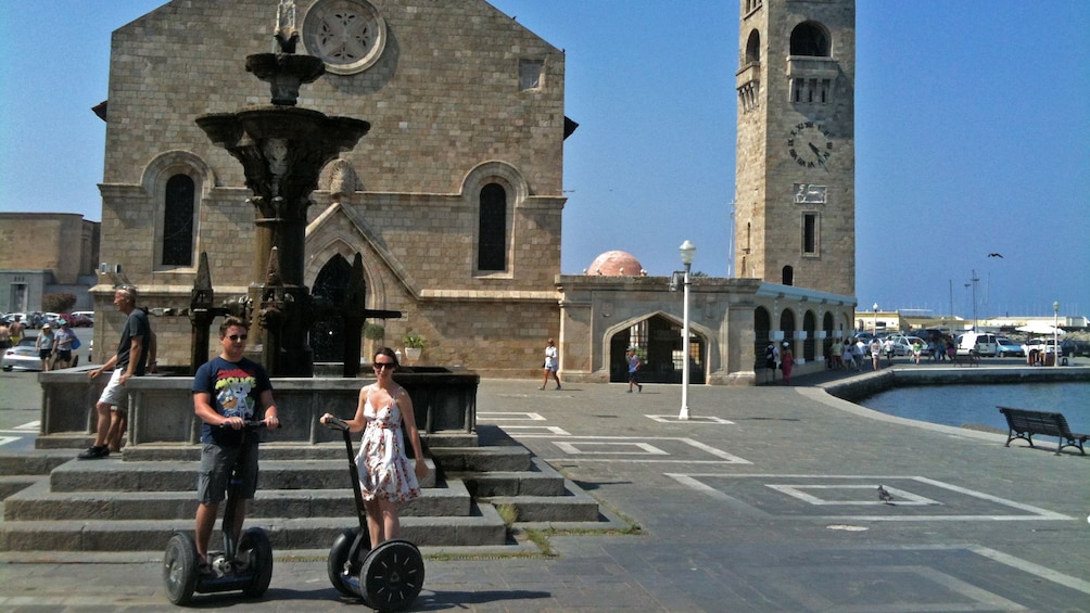 Show item 4 of 5. segway riders near landmark in Rhodes