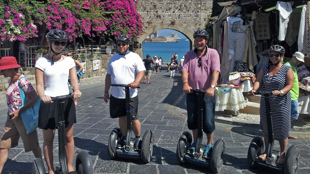 Show item 1 of 5. segway riders in town street in rhodes