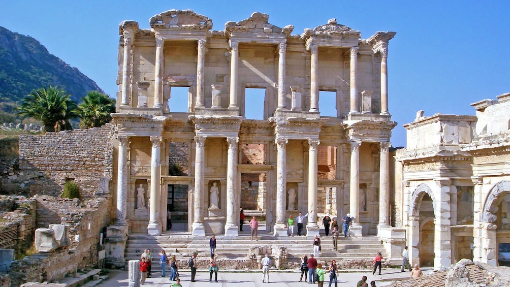 Show item 4 of 5. Visitors outside the library of Celsus