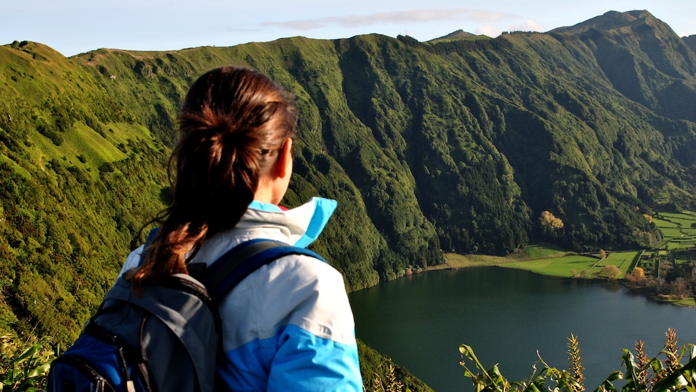 Woman looks down at lake during Sete Cidades Half-Day Safari