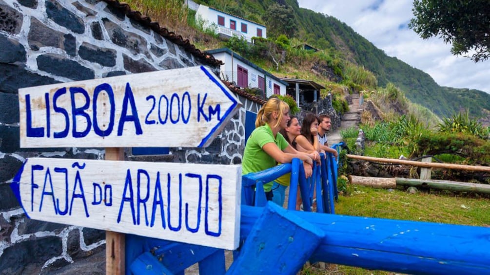 Close up of painted blue and white street signs.