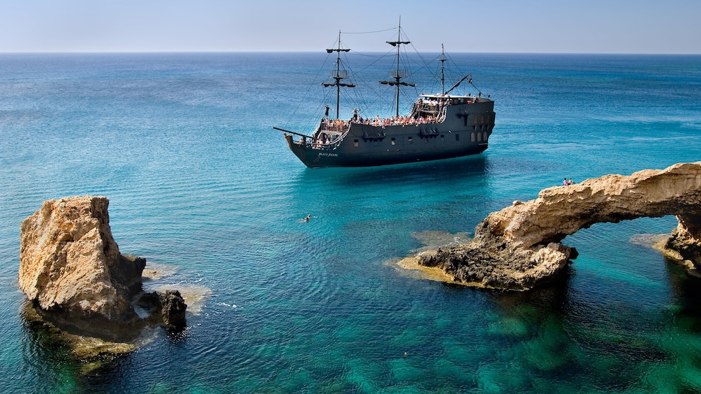 ship at sea near rock formations in cyprus