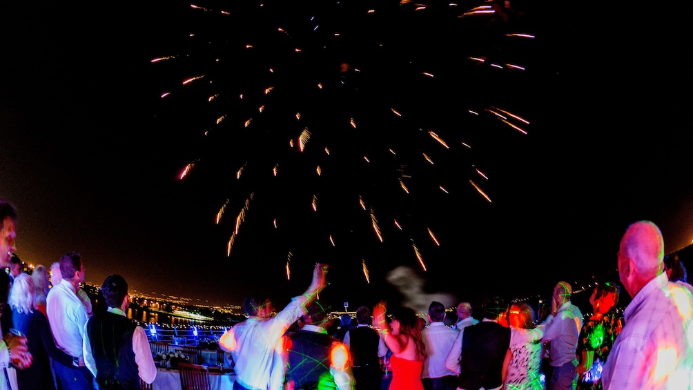 Patrons enjoy fireworks on deck of WaveDancer