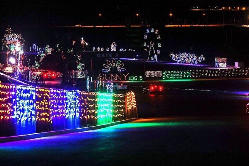 A little holiday magic! The Vegas tribute display shines in the background as you exit a light tunnel. 