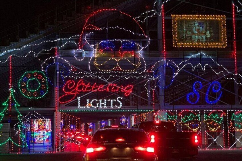 Cars drive through the magical Glittering Lights entrance as they embark on a holiday journey perfect for a family night out.