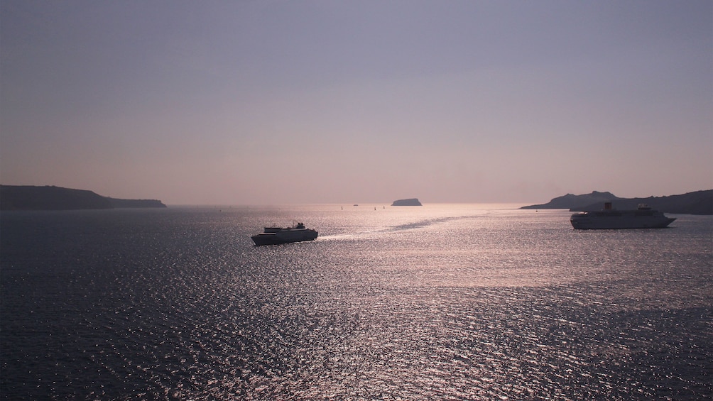 Ships sailing the waters around Santorini