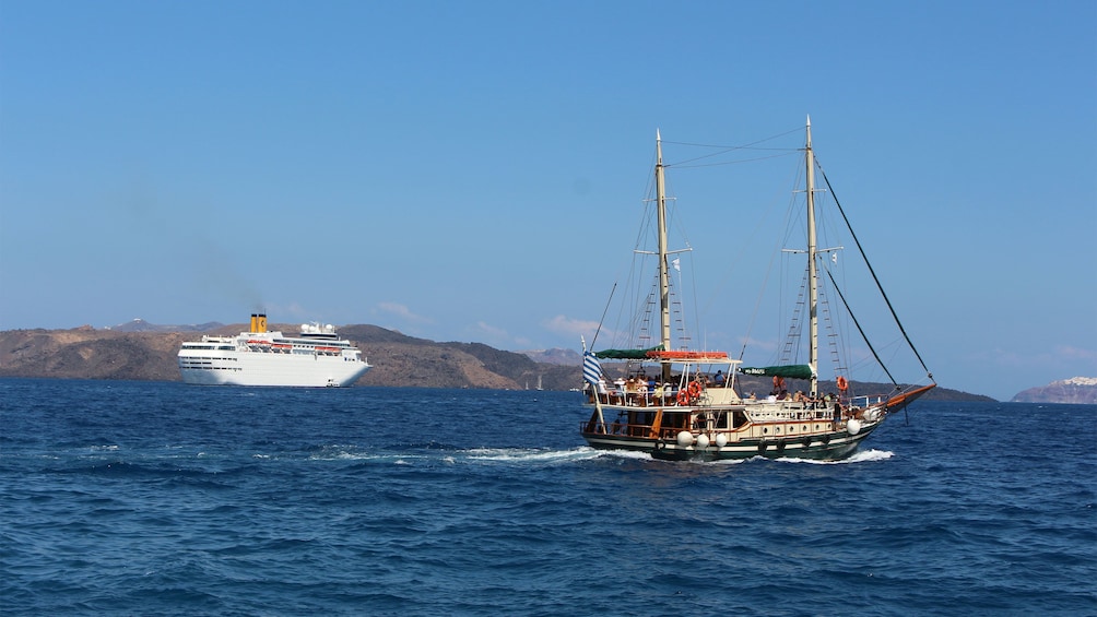 A yacht and a Schooner on the waters around Caldera