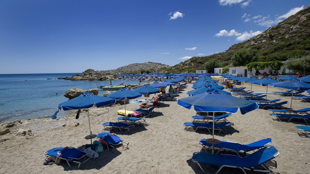 beach with lounge charis and umbrellas 