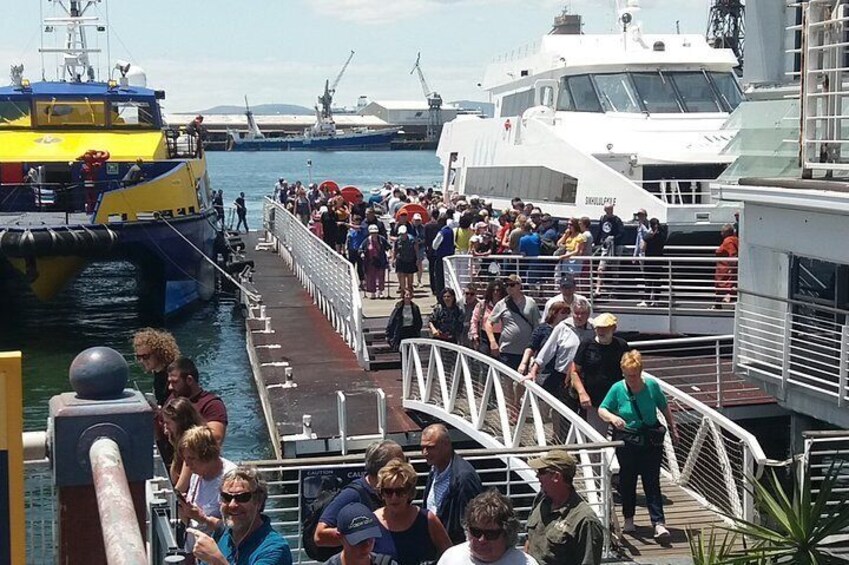 Travelers return form Robben Island