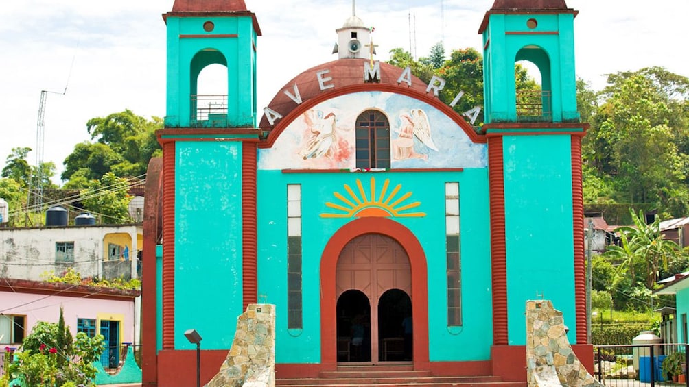 A stucco building called Ave Maria in Mexico