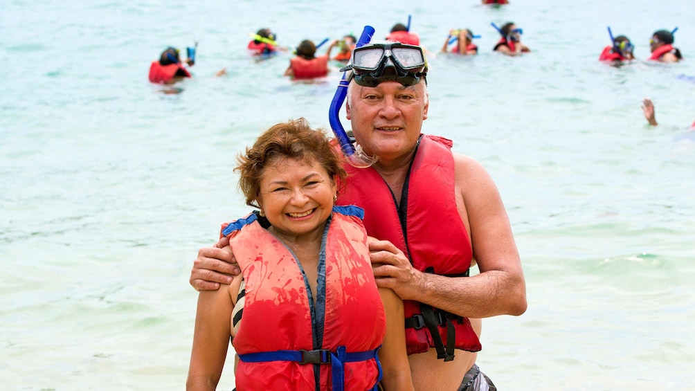 Two snorkelers with lifejackets on