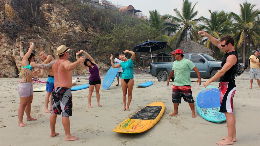 people stretching on the beach in mexico