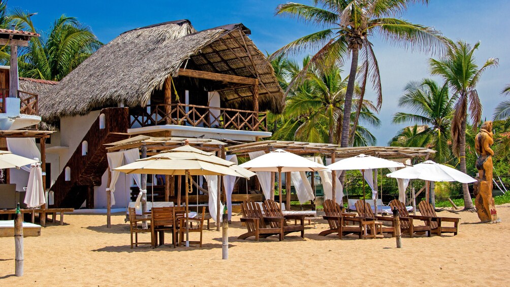 Tables, chairs, and umbrellas on a Mexican beach